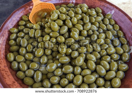 Green delicious marinated olives. Background. Texture. Greece.