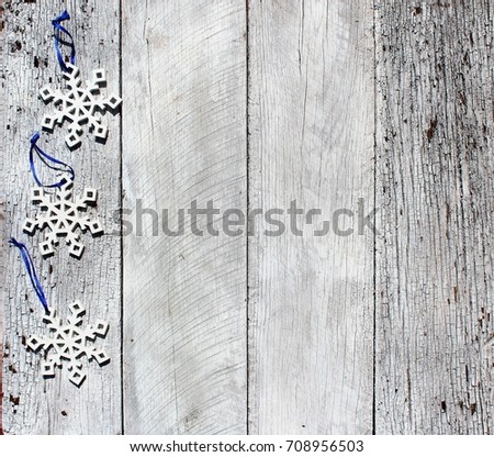 snowflakes on rustic wood background