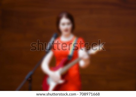 
Blurred background performance on the scene of people in the assembly hall