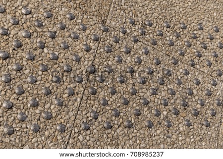 Cement pavement with metal pins