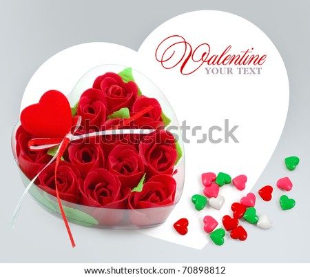 Heart-shaped box with red roses on a background a heart