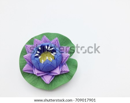 Purple artificial lotus on white background
