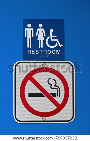 A no smoking sign at a rest stop.