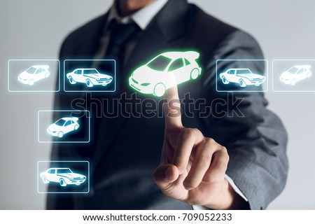 Businessman is shopping online to choose a cars to buy about internet of thing concept, Business background. Royalty-Free Stock Photo #709052233