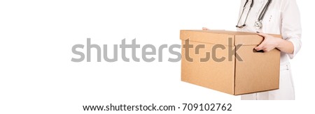 doctor holding box. image on a white studio background.