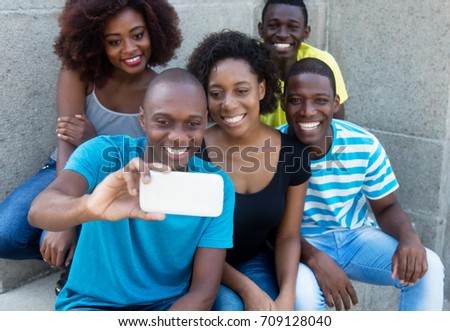Group of five african american men and woman taking selfie