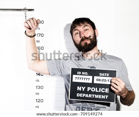 bearded man in handcuffs with sigarette, Criminal Mug Shots