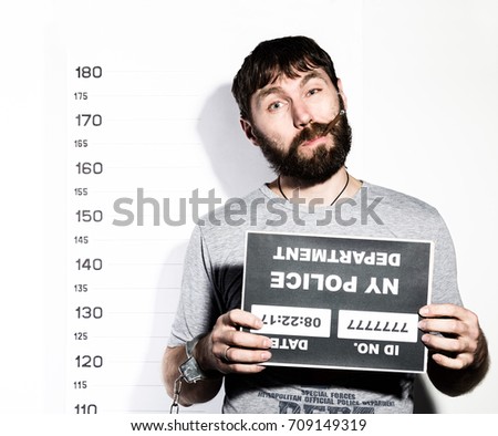 bearded man in handcuffs with sigarette, Criminal Mug Shots
