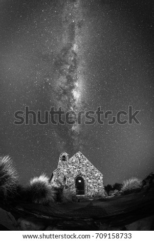 Night in Lake Tekapo with a Church of the Good Shepherd and milkyway in background, black and white image
