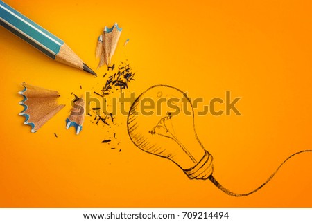 the yellow pencil with  hand drawn a light bulb , creative innovation idea symbol concept