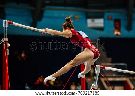 uneven bars female gymnast to competition in artistic gymnastics Royalty-Free Stock Photo #709217185