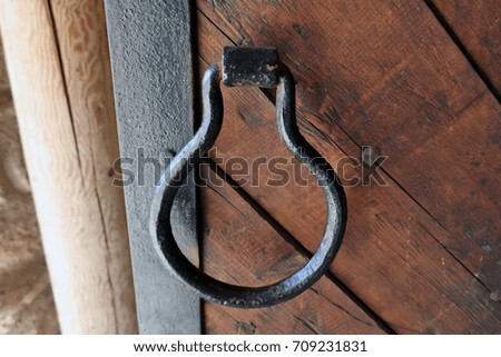 antique handle of a large wooden door