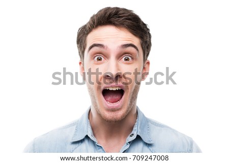 portrait of excited handsome man looking at camera, isolated on white