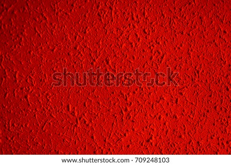 Closeup of red color grunge textured wall with  vignetting, may use as background with copy space for text
