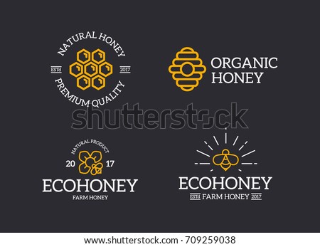 Set of retro vintage honey and bee, honeycomb, hive logo or insignia, emblems, labels and badges and other branding objects. Vector line style Royalty-Free Stock Photo #709259038