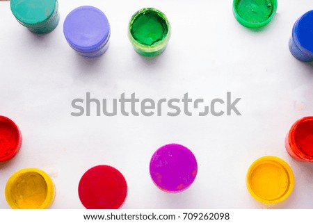 cans with colorful pains on white background. not isolated