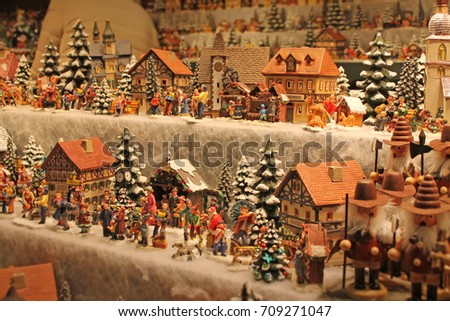 Christmas decoration for sale on advent market. Decorative miniature city houses.  Austria,Salzburg. Royalty-Free Stock Photo #709271047