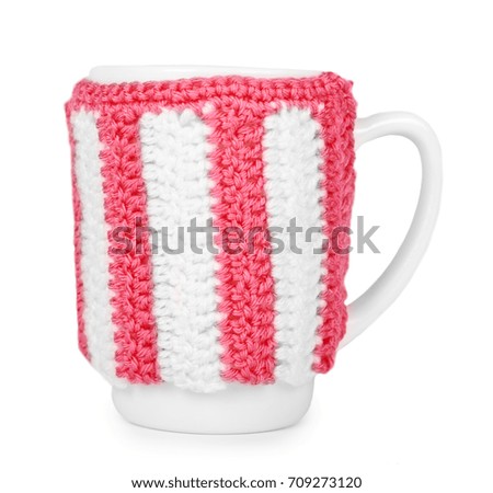 knitted tea cup isolated on white background
