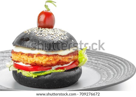 Black burger isolated on white background.