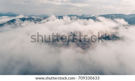 amazing view of mountains  in the morning mist. aerial photography