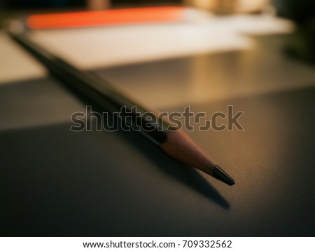 macro pencil is on the table in office, Office leather desk table with pen and pencil. perspective with copy space