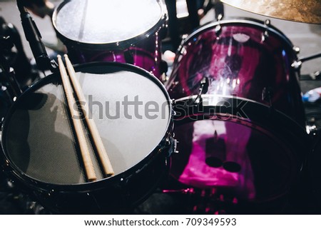 Musical instruments. Drum set on a club stage. Вrumsticks lie on the drum