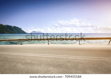 background of empty summer road and sea 