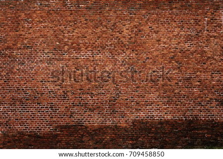 red brick wall texture grunge background with vignetted edges, may use to interior design