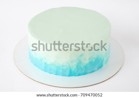 Cake with whipped blue cream. Picture for a menu or a confectionery catalog. Close up