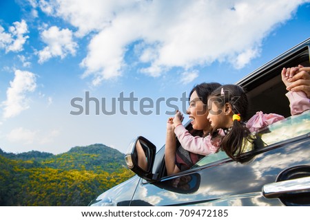 Asian mother and daughter enjoy travel in a car with mountain background Royalty-Free Stock Photo #709472185