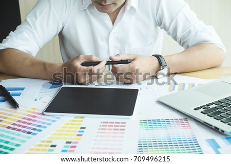 Close up hands male graphic designers,interior designer.Working on graphic tablet in modern space office.discuss data about new start up project of graphics design style and graphics design diagram
