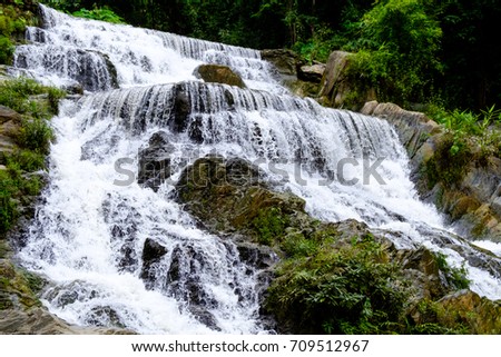 Strong flow water from Mae Phun waterfalls in Laplae District, Uttaradit province of Thailand