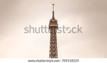 the top of the Eiffel Tower in bad weather
