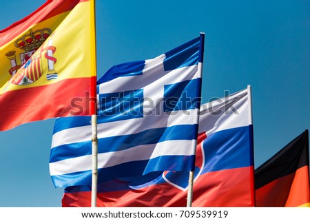 flags of different countries against the blue sky