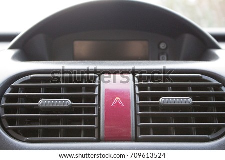 Control panel of air conditioner and emergency light button inside old car. emergency stop.