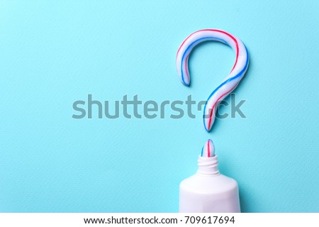 Symbol of question mark from toothpaste. Copy space for text Royalty-Free Stock Photo #709617694