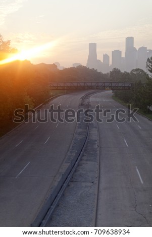 Sun rising over the city skyline in Houston, Texas with empty streets after Hurricane Harvey disaster