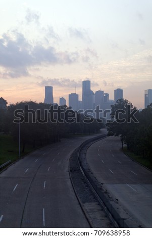 Sun rising over the city skyline in Houston, Texas with empty streets after Hurricane Harvey disaster