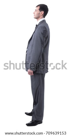 Side view of serious businessman with crossed hands on white