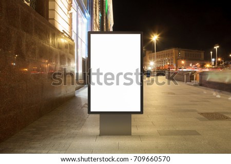 Blank street billboard at night city. Isolated with clipping path around advertising display. 3d illustration.
