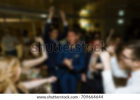 Blurred people at birthday party.