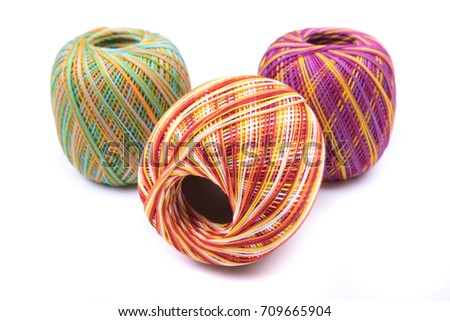 Crochet and colorful knitting thread background. Bright background of balls of yarn variety. Three balls.  Handwork, leisure, hobby concept.