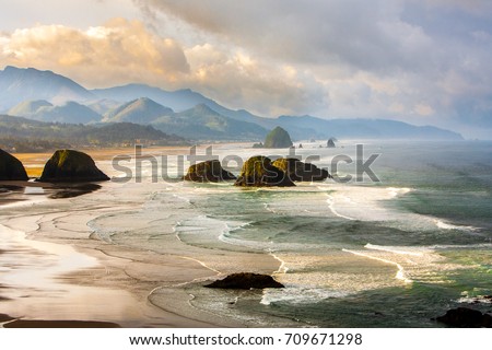 View from Ecola State Park looking south toward Canon Beach and haystack Rock, Oregon coast. Royalty-Free Stock Photo #709671298