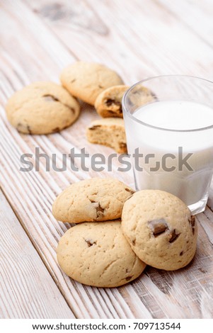biscuits, cookie with milk on white wooden background