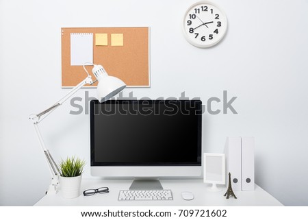 Modern home office computer monitor workspace on white desk