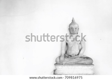 Sandstone statues of Buddha. Black and white picture. This image was blurred 