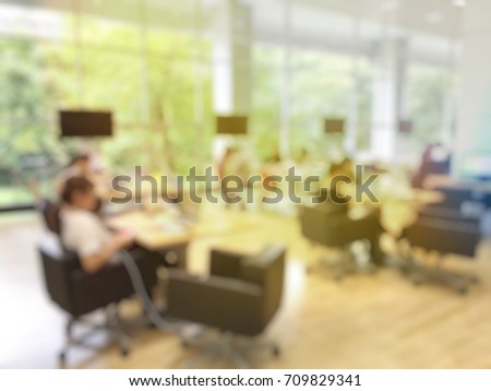 Education Concept: blurred image of student reading in modern library. Interior modern library for relax education in university. blurred university students training / reading / searching for books
