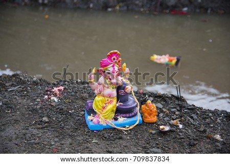 Hindu God Ganesha in water, immersion of God Ganesha