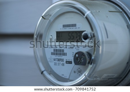 A smart electric power meter measuring power usage Royalty-Free Stock Photo #709841752