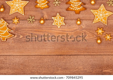 christmas homemade gingerbread cookies on wooden table, top view, copy space
